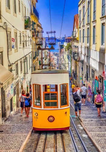 people-walking-on-street-near-yellow-tram-3780224